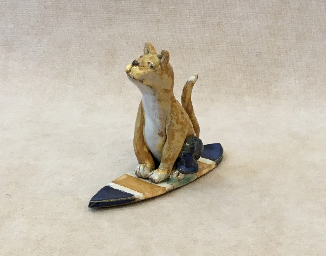 Surfing Cat by Robin Fahey Cameron hand built clay
