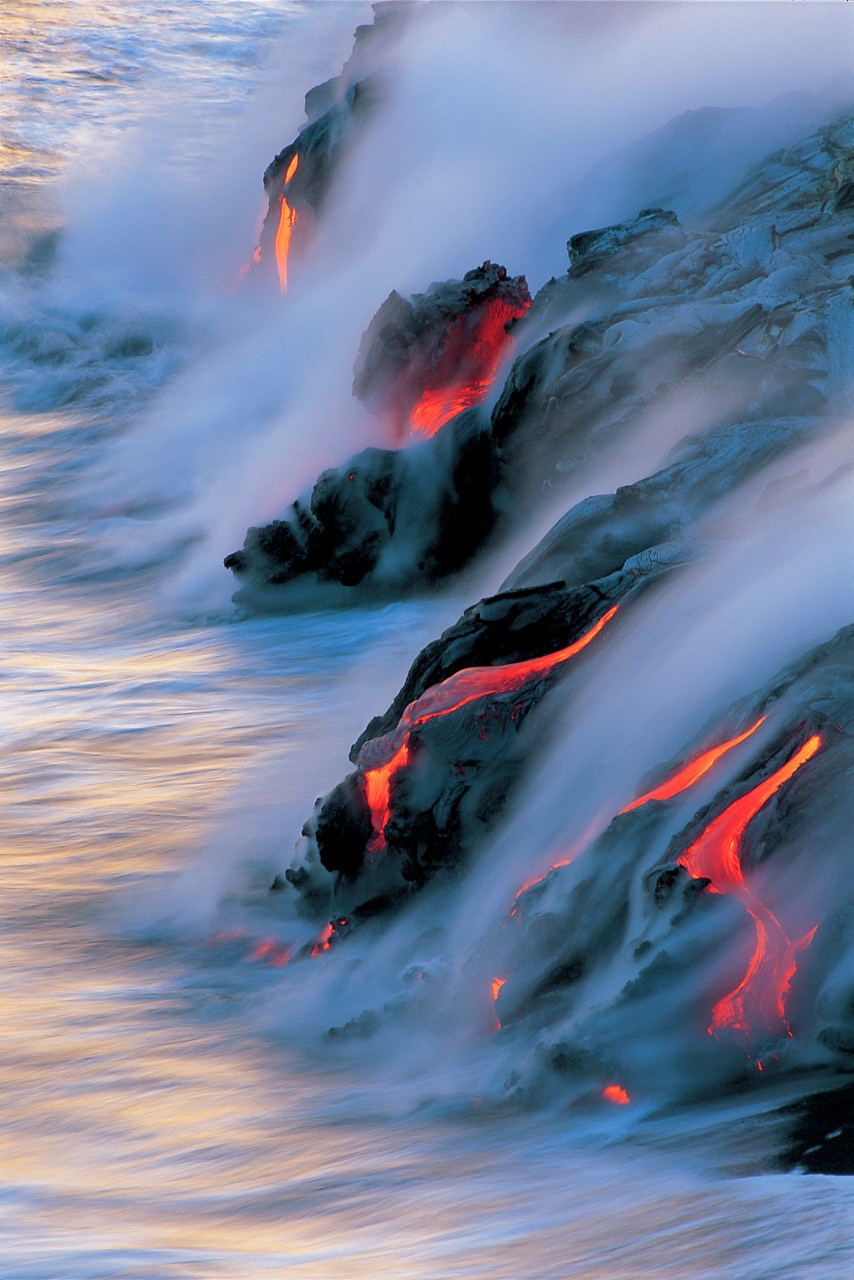 The ocean steams from the Kilauea lava flow in this photo by Brad Lewis. Kilauea is the most active volcano on Earth.