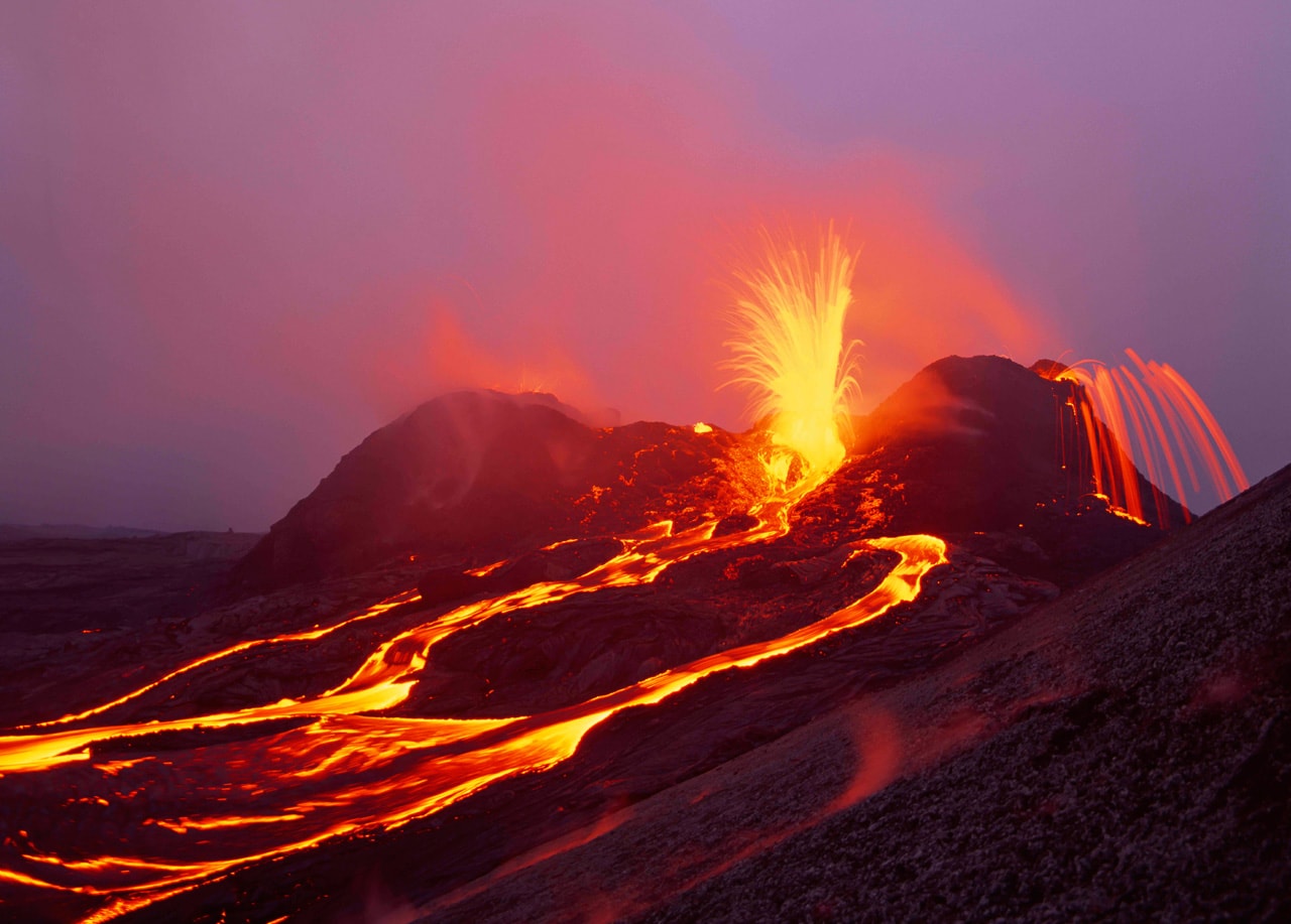 Kilauea splits apart and spurts along a rift zone in this photo by Brad Lewis. Kilauea is the most active volcano on Earth.