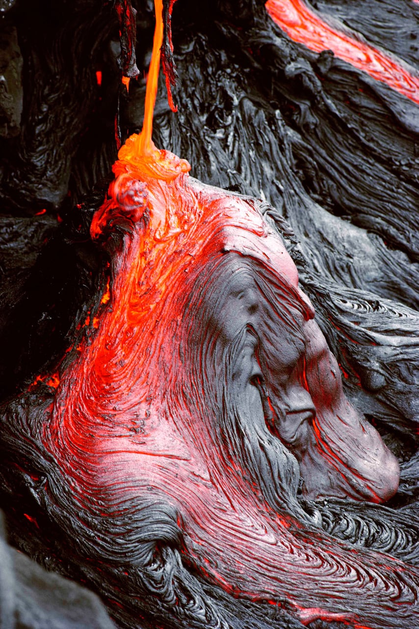 A wizened god appears in the lava in this photo by Brad Lewis. Kilauea in Hawaii is the most active volcano on Earth.