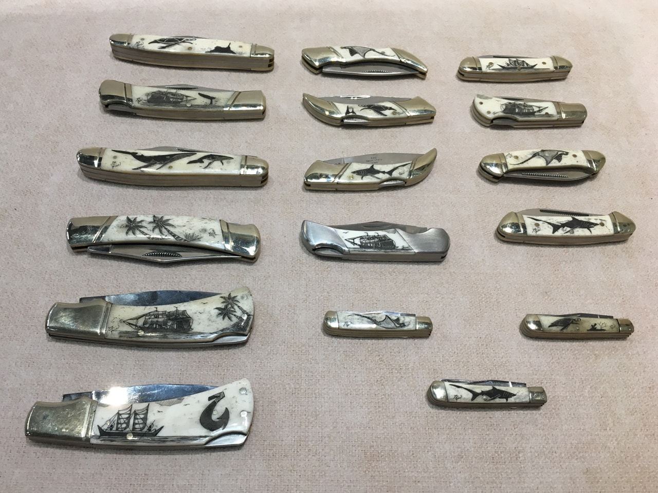 Hawaii-made scrimshaw pocketknives by Derek Fine. Crafted from cow bone and steel in a variety of hand-etched nautical and ocean themes.