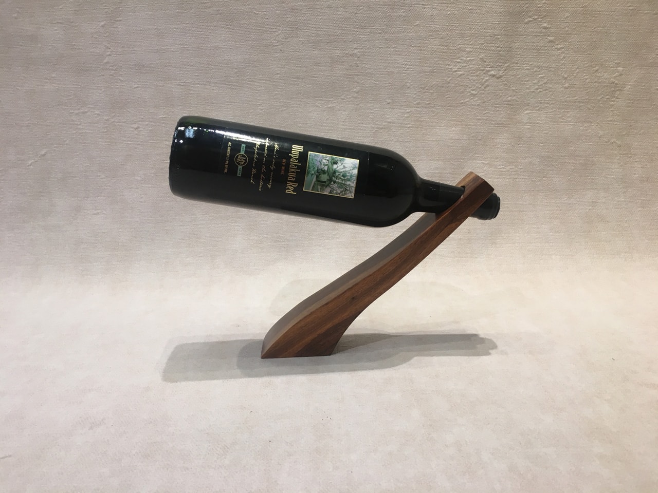Wine Bottle Holder with a bottle of wine