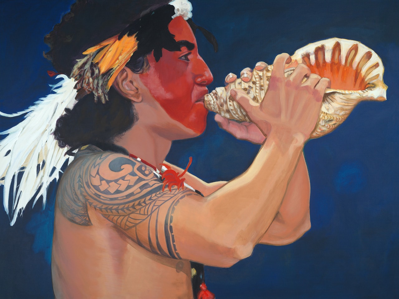 A young Hawaiian man with a painted face and tribal arm tattoo blowing a conch shell