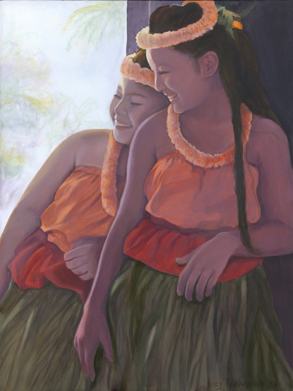 Two young sisters laughing while in their orange and red hula attire