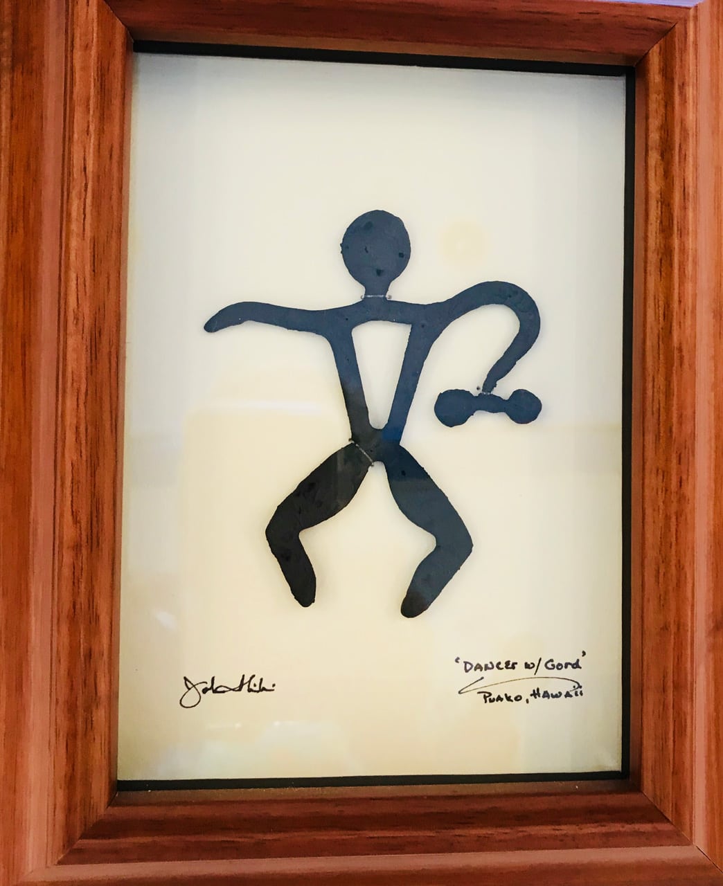 Framed metal sculpture entitled Dancer with Gourd by John Ilnicki