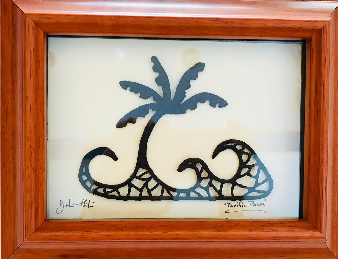 Framed metal sculpture titled Ocean Palm by John Ilnicki