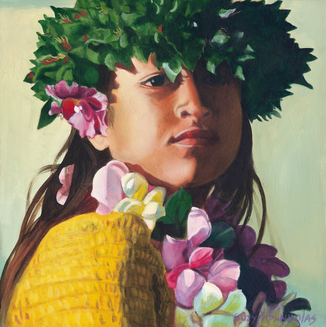 The face of a young hula dancer wearing yellow and a ti leaf haku and a muli color plumeria lei