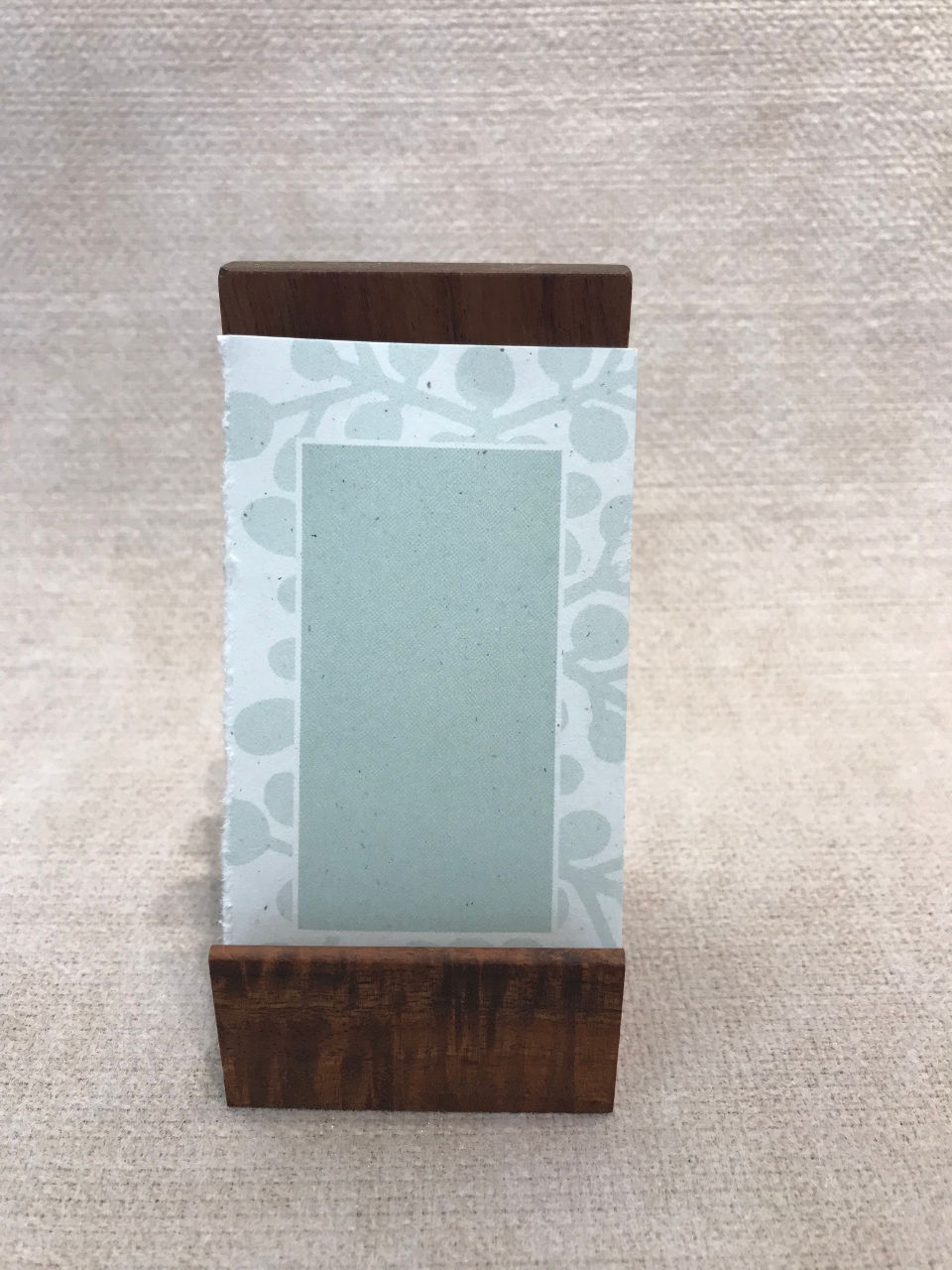 Vertical wood business card holder in koa for the desk, handcrafted in Hawaii.