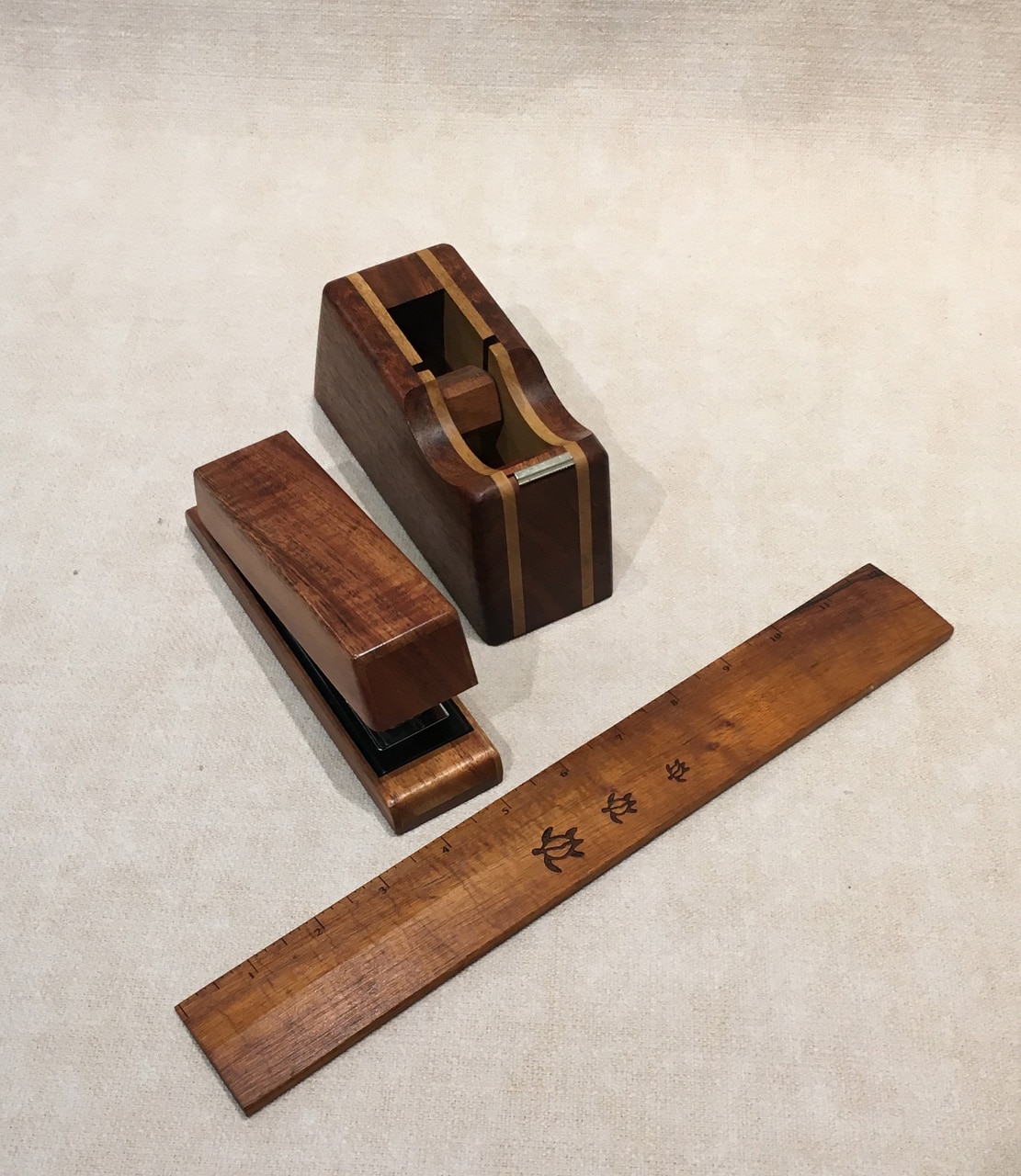 Standard 12" wood ruler, wood stapler, and wood tape dispenser in koa for the desk, handcrafted in Hawaii (available for purchase separately).