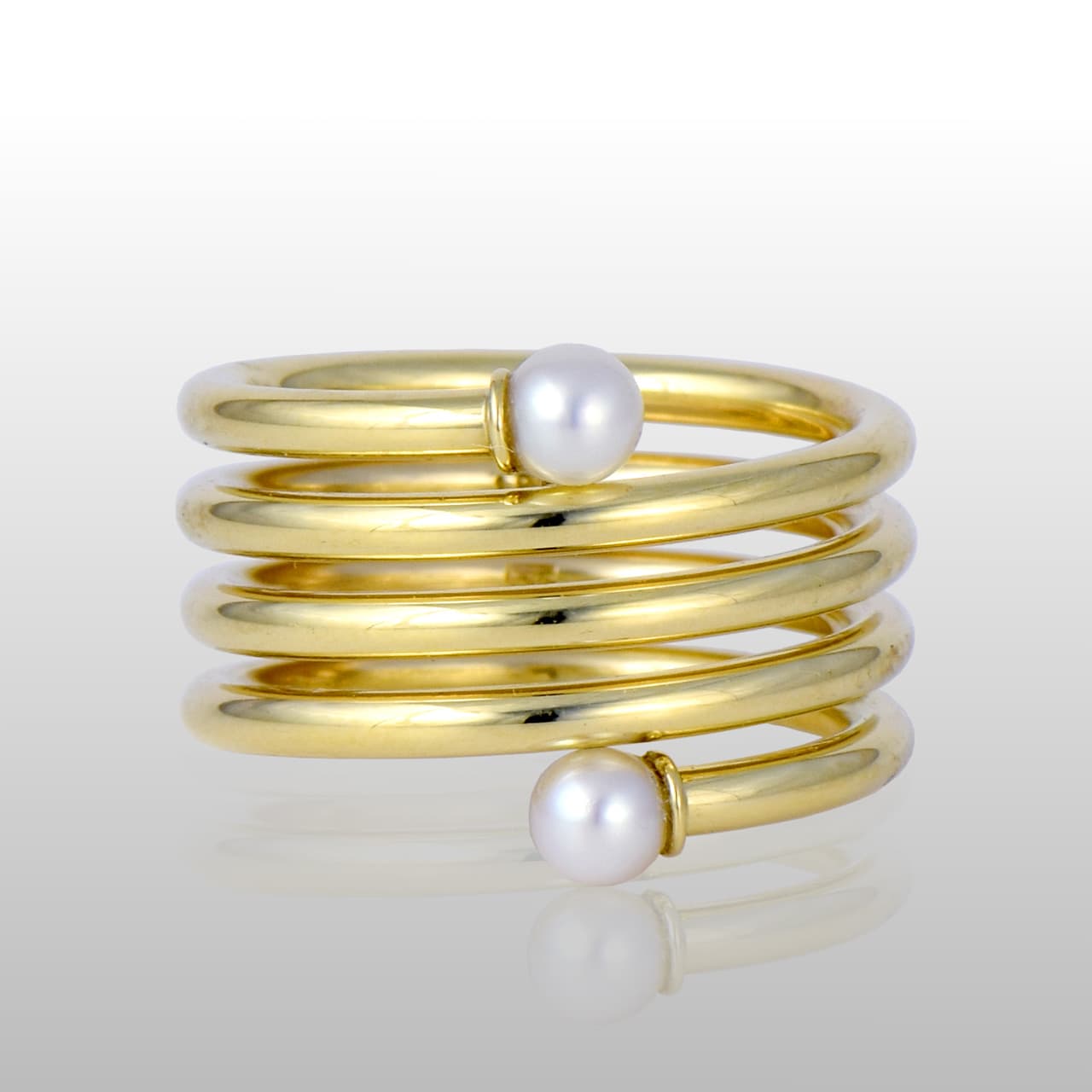 18k yellow gold spirla ring, 5 bands, with a round white pearl on each end