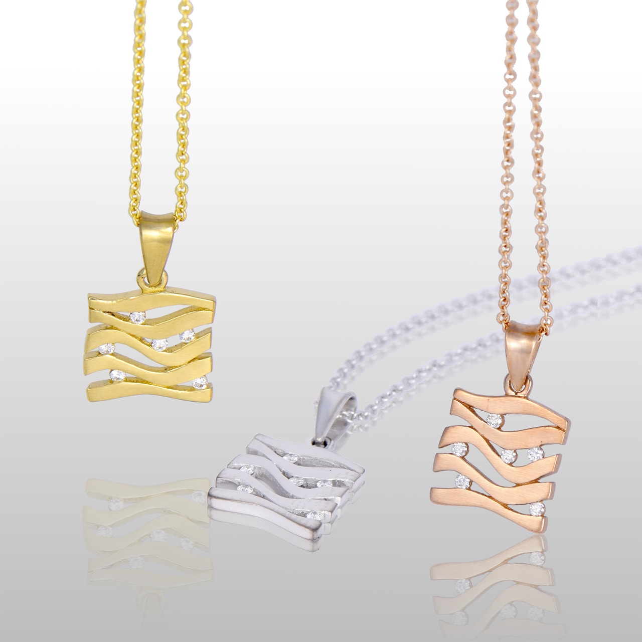 three square pendants, white, yellow and rose gold. With lines and diamonds