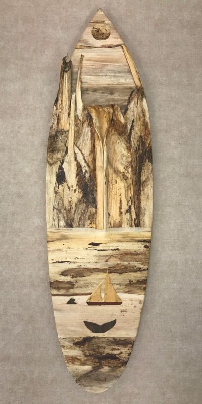 Large surfboard wall hanging from the mind of Baz Cumberbatch. He carves the background from wood, then adds layers of natural fibers by hand