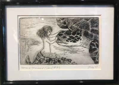 an original print of a mermaid gently touching the face of a large sea turtle