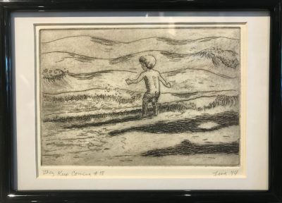 an original print of a young boy standing by the shore as waves crash at his feet