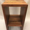 a stand, or shelf made of Hawaiian Koa and Wenge wood. Shocked with electricity to form an organic design. Front View