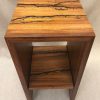 a stand, or shelf made of Hawaiian Koa and Wenge wood. Shocked with electricity to form an organic design. Top View