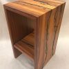 a stand, or shelf made of Hawaiian Koa and Wenge wood. Shocked with electricity to form an organic design. Side View