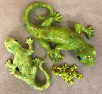 three different sized ceramic geckos with three different shades of green coloring