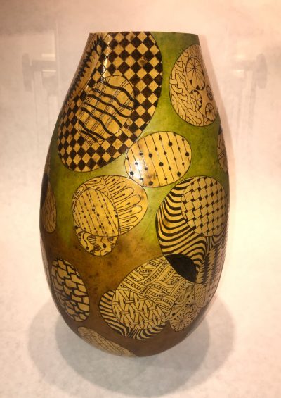 tall skinny gourd handpainted base color of chartreuse with handpainted black and light green geometric patterns