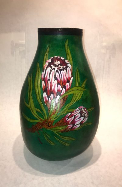 tall skiny dark green dyed gourd handpainted with pink and red protea flower with light green leaves