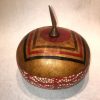 short wide round hand dyed red bottom with bubble motif tan lid with knife shaped handel and geometric design by Maui local artsit Jaz Staley
