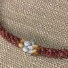 Ni’ihau lei, 19″ 4-tie Poepoe with Pikake Momi. Created by master artisan Kanani Puo.