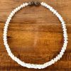 Ni'ihau Lei, 21" Pikake Momi, Brown Tip. Crafted by master artisan Mo Katoush.